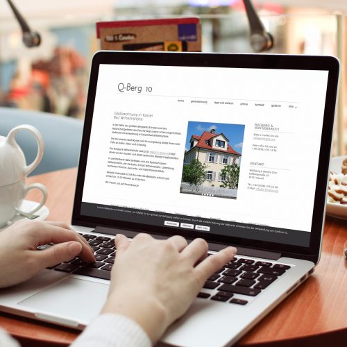 web design for client Q-Berg 10 shown on laptop